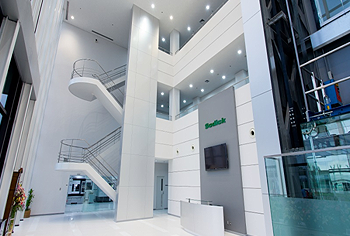 The still new building features a spotless, all-white entry area
