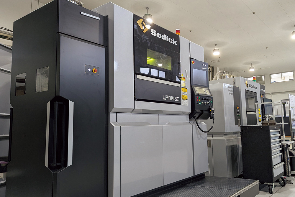 The introduced Sodick metal 3D printer LPM450 (photo foreground)