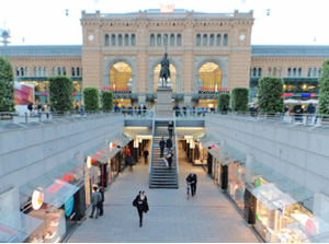 Lively shopping street in front of the station